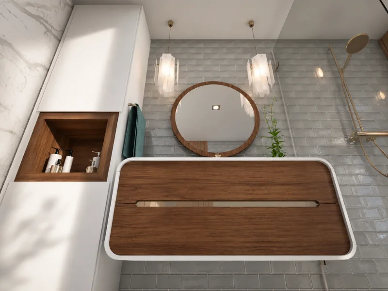 Contemporary bathroom with a floating wood vanity, round mirror, gray subway tiles, pendant lights, built-in storage, and brass shower fixtures.