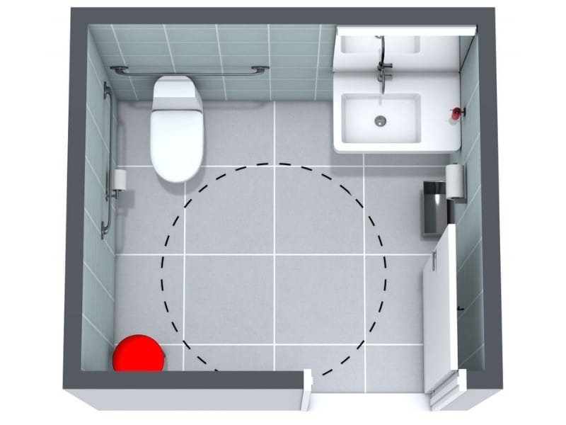 Accessible bathroom floor plan with toilet and sink, shown from above. A dotted circle marks the wheelchair turning space in the center of the room.