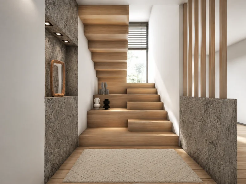 Sculptural wood staircase with staggered steps, stone accent walls, vertical wood slats, and a tall window.