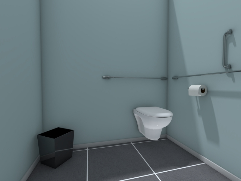 ADA-compliant bathroom stall with wall-mounted toilet, horizontal and vertical grab bars, toilet paper holder, and small black waste bin against light blue walls and dark tile flooring.