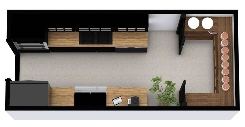 A 3D top-view rendering of a long galley kitchen with wood countertops and black cabinets. One side has the cooktop and sink, and the opposite side includes a refrigerator and small appliances. At the far end, an L-shaped counter creates a compact breakfast nook with stools.