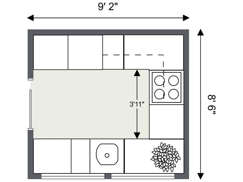 U-shaped kitchen floor plan measuring 9 feet 2 inches wide by 9 feet 6 inches long. The layout shows counters and cabinets on three sides, with a walkway of 3 feet 11 inches between the opposite counters. The sink is centered on the bottom wall and the cooktop is on the right wall.
