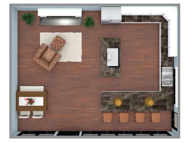 3D floor plan of an open-concept space with a large U-shaped kitchen on the right. The kitchen has dark stone countertops, a sink on the right wall, and bar seating for four along the bottom counter. A kitchen island sits in the center of the room. The left side of the space includes a small dining table and a cozy seating area with two chairs and an ottoman.
