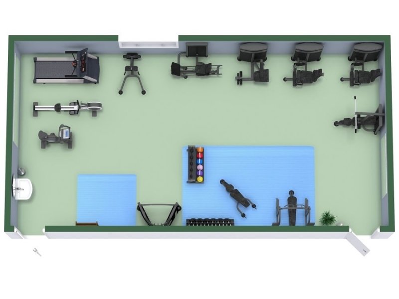 3D floor plan of a compact gym with green flooring and blue workout mats. The layout includes treadmills, exercise bikes, and rowing machines along one wall, a weight bench and dumbbells on the opposite side, and a stretching area with mats and fitness balls in the center.