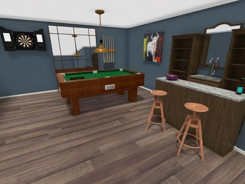 3D Photo of a basement home bar. On the back wall hangs a dartboard, a floor mirror and a pool cue rack. On the side wall is a painting, and bar shelves, a sink and a mirror above the sink. On the floor is a pool table. There is a bar table with two barstools in front of it. On top of the counter is a bowl of snacks and a drink.