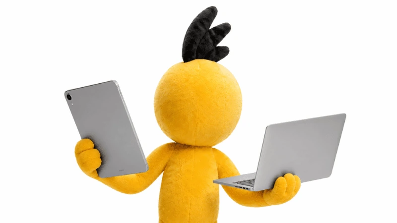 The RoomSketcher mascot holding a tablet and a laptop.