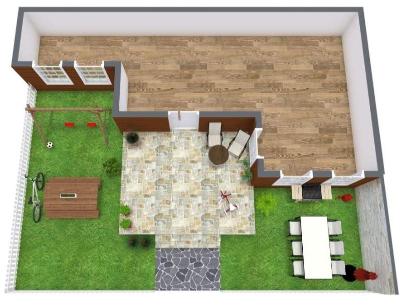 Top-down view of a backyard layout with a central stone patio connected to the house, surrounding lawn areas, an outdoor dining table, lounge seating, and a small play and storage area along the fence.