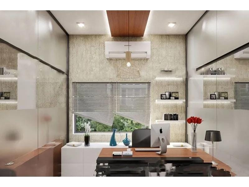 3D photo of an office made with Homestyler. The photo shows a singular office room, one wooden desk with a computer and a vase with flowers in as decor. The office chair is black and has it's back facing a window and the wall. On the wall are three lit-up shelves. The windows are covered by blinds.