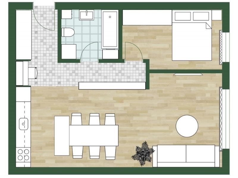 2D floor plan of a one-bedroom apartment with an open layout. The design features a combined kitchen, dining, and living area, a separate bedroom, and a bathroom located near the entrance.