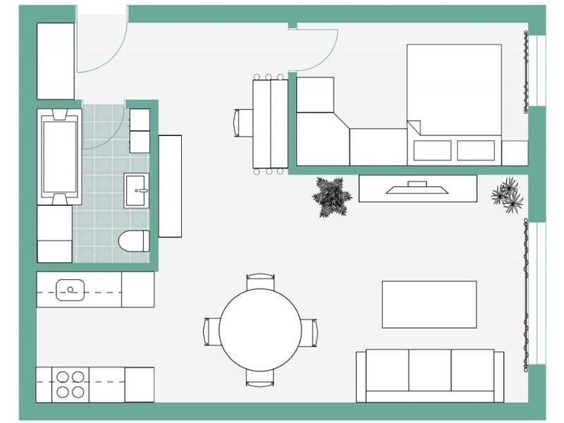 2D floor plan of a compact one-bedroom apartment with an open kitchen, dining, and living area, a separate bedroom, and a bathroom. The design includes a round dining table, sofa, and plants for decoration.
