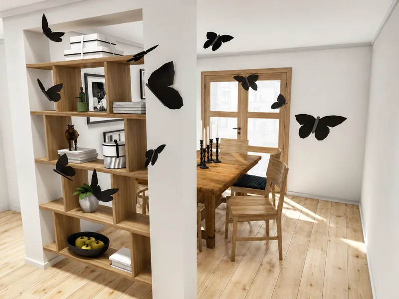 Bright dining area with a wooden table and chairs, open shelving, black candlesticks, and oversized black butterfly decorations on the walls and partition.