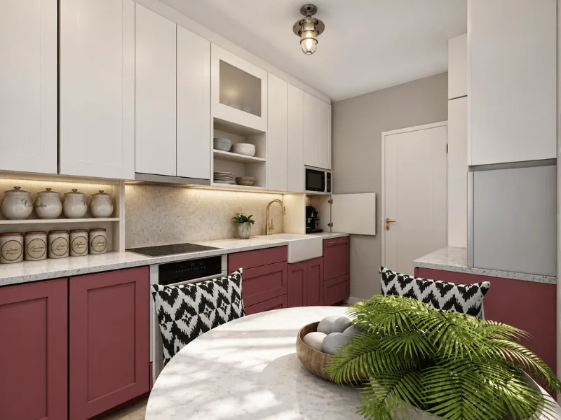 Small kitchen layout with red lower cabinets, white upper cabinets, and a compact dining table.