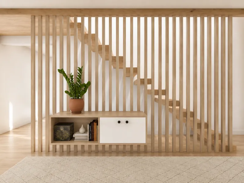 3D render of a minimalist interior featuring a floor-to-ceiling light wood slat partition with a staircase visible behind it. A low built-in cabinet holds books, decor, and a potted plant, with a pale patterned rug in the foreground.