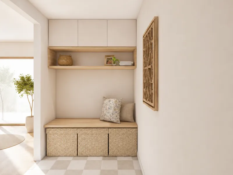 3D render of a bright minimalist hallway with a recessed built-in bench, woven storage cabinets, overhead cupboards, and a wooden display shelf. Neutral cushions, small decorative objects, wall art, and a nearby potted tree add warmth to the light interior.