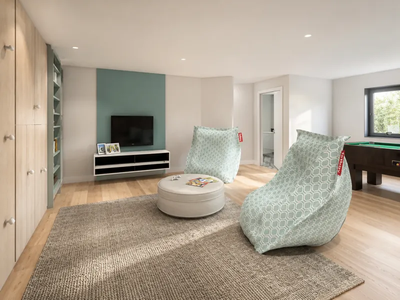 Modern recreation room with light wood flooring, built-in storage, a wall-mounted TV, two oversized patterned beanbag chairs, a round ottoman, a textured area rug, and a pool table near the window.