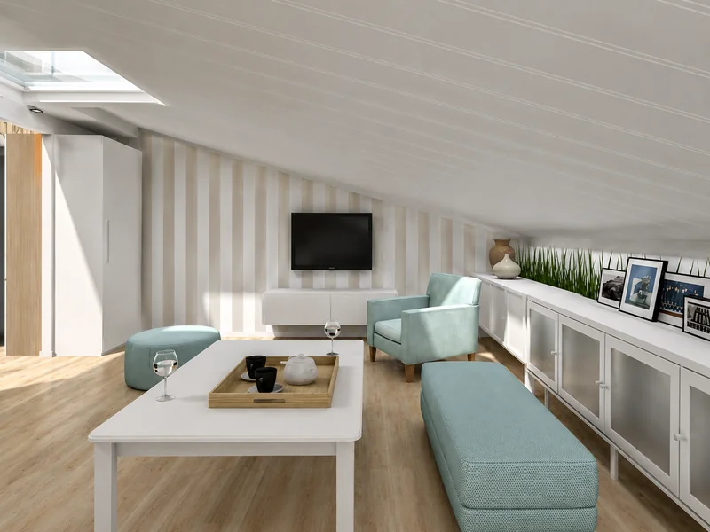 Attic lounge with a sloped ceiling, skylight, wall-mounted TV, pale blue armchair and ottomans, a white coffee table, and built-in storage topped with framed photos and plants.