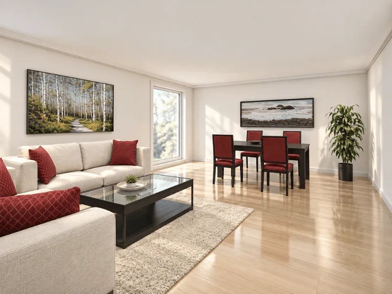 Open-plan living and dining room with cream sofas, red accents, a glass coffee table, and dining area.