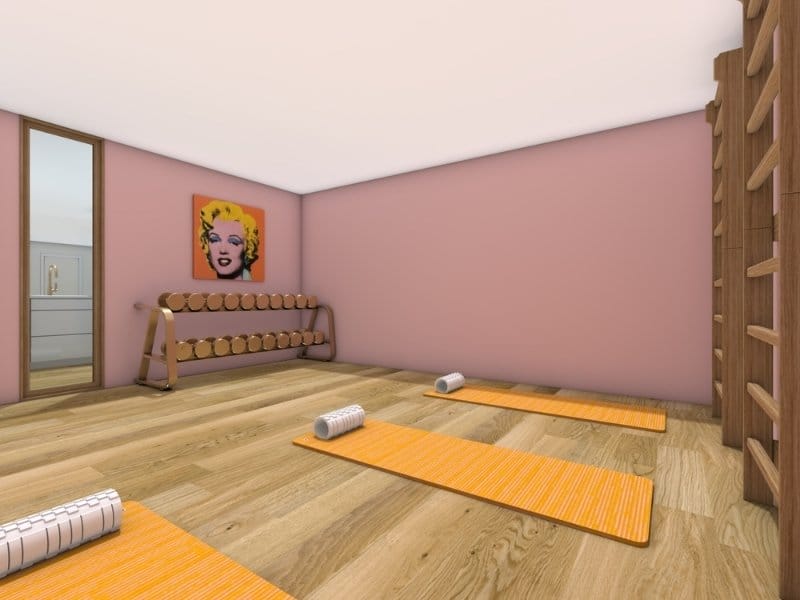 3D photo of a home gym or yoga room with pink walls, wood flooring, and orange yoga mats with foam rollers. A dumbbell rack stands against the wall below pop art, and a large mirror is placed beside the doorway.
