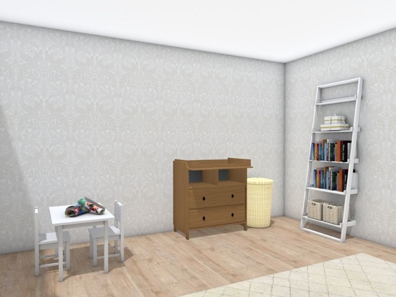 Nursery corner with a small white children’s table and chairs set with toys on top, a wooden dresser with drawers, and a woven laundry basket.