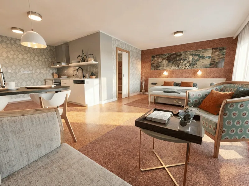 Open-plan studio with clear circulation space between the kitchen, dining, living, and sleeping areas for accessible everyday living.
