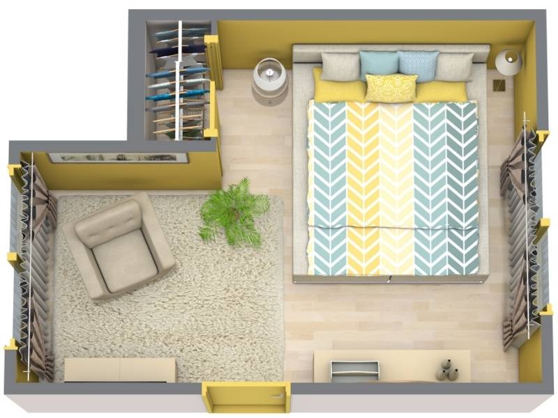 3D floor plan of a colorful bedroom with a double bed against the top wall, decorated with a yellow, teal, and white chevron-patterned bedspread. The room includes nightstands on both sides of the bed, two closets with hanging clothes, and a cozy sitting area on the left with a beige armchair, shaggy rug, and a potted plant. Light wood flooring and yellow walls complete the design.