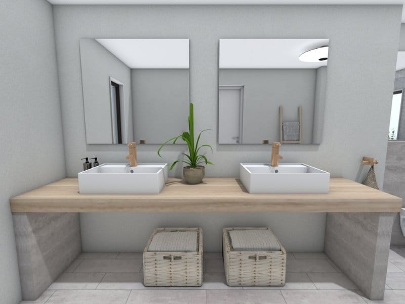 Modern bathroom vanity with two square vessel sinks on a wooden countertop, matching mirrors above, a potted plant in the center, and wicker storage baskets underneath.