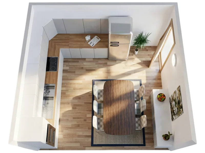 Aerial three-quarter view of a compact kitchen and dining room with white cabinetry, wood countertops, and light wood flooring. A stainless-steel refrigerator stands along the back wall beside a small potted plant and a large window or glazed door. In the center, a dark wood dining table with six upholstered chairs sits on a rectangular rug.