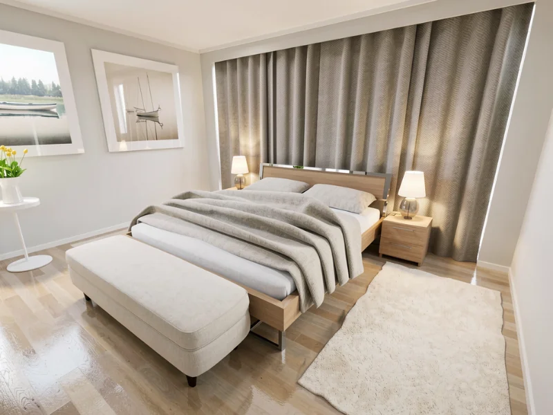 Helles Schlafzimmer mit Doppelbett, grauer Bettwäsche, gepolsterter Bank, Nachttischen, Lampen und bodenlangen grauen Vorhängen.